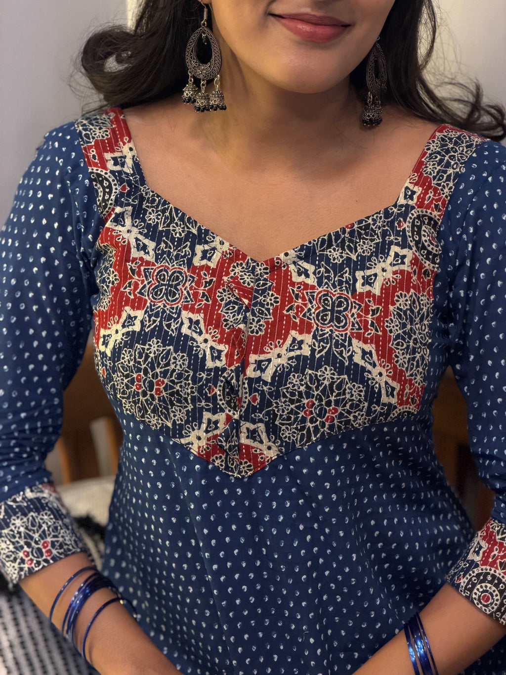 Close-up of hand-block printed yoke on [PBC1001] – red and cream floral-paisley motifs on navy cotton