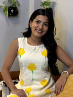 [PBC1002] Ivory Marigold Jaipur Hand-Block Cotton – seated portrait showing marigold print detail