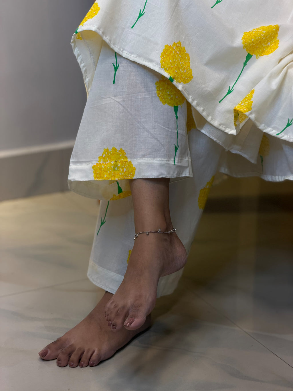 Close-up of hem and matching print bottoms on [PBC1002] – yellow marigold block print on ivory cotton