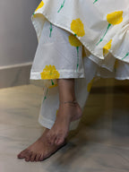 Close-up of hem and matching print bottoms on [PBC1002] – yellow marigold block print on ivory cotton