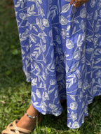 Hem and skirt detail of [PBC1007] Periwinkle Tulip Frill Dress – fabric drape on grass
