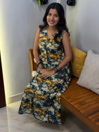 [PBC1008] Nandi Pichwai Jaipur Hand-Block Cotton – seated on bench, smiling, indoor studio