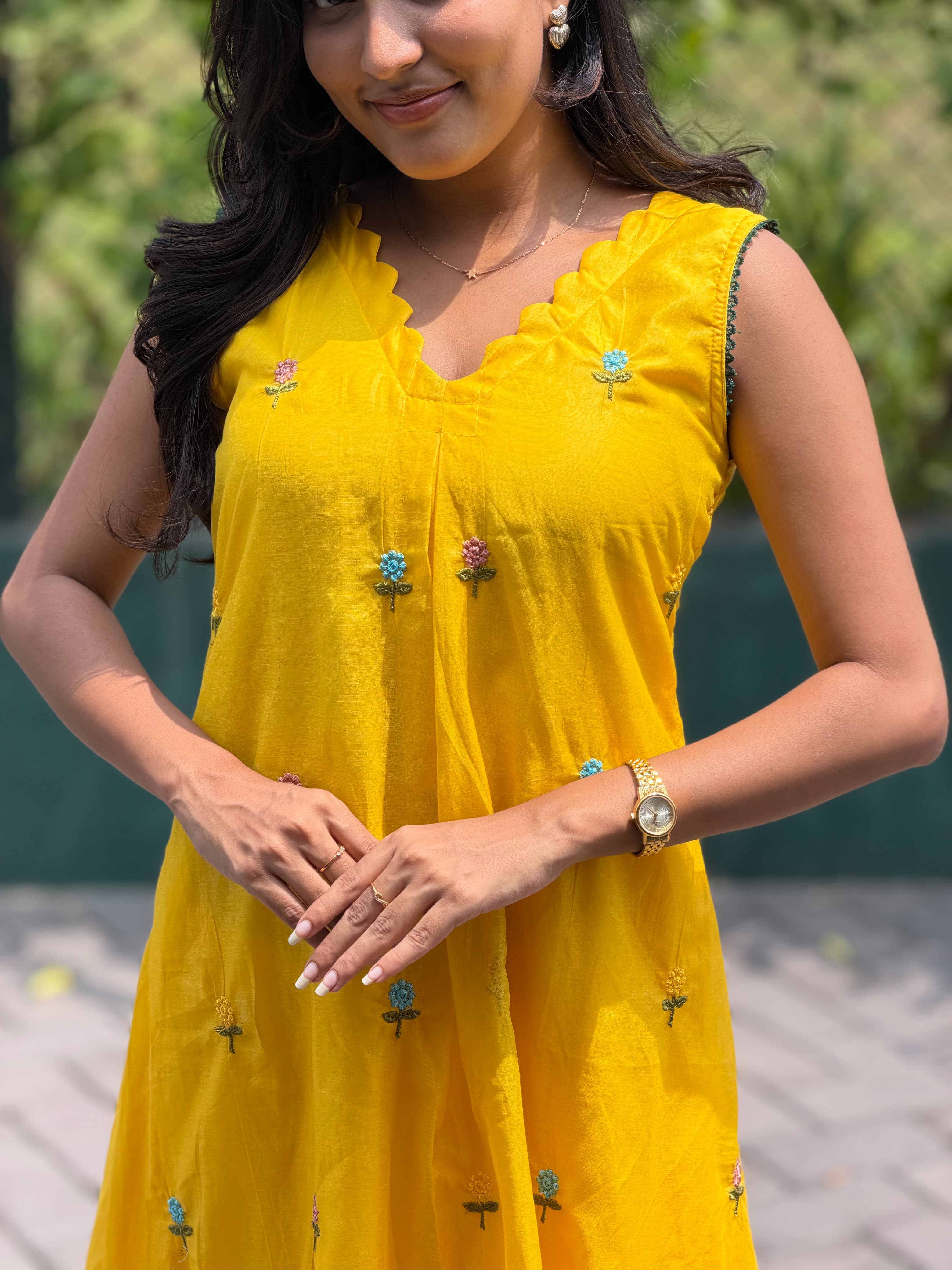 Close-up of ruffle neckline and multicolor floral embroidery on [PBC1010] – sunshine yellow Chanderi Silk