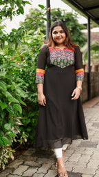 [PBC1016] Black Heritage Yoke Cotton-Georgette Blend A-Line Kurti – full-length front view, outdoor garden