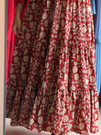 Detail of [PBC1029] – terracotta cotton showing tiered hem and cream lotus block print