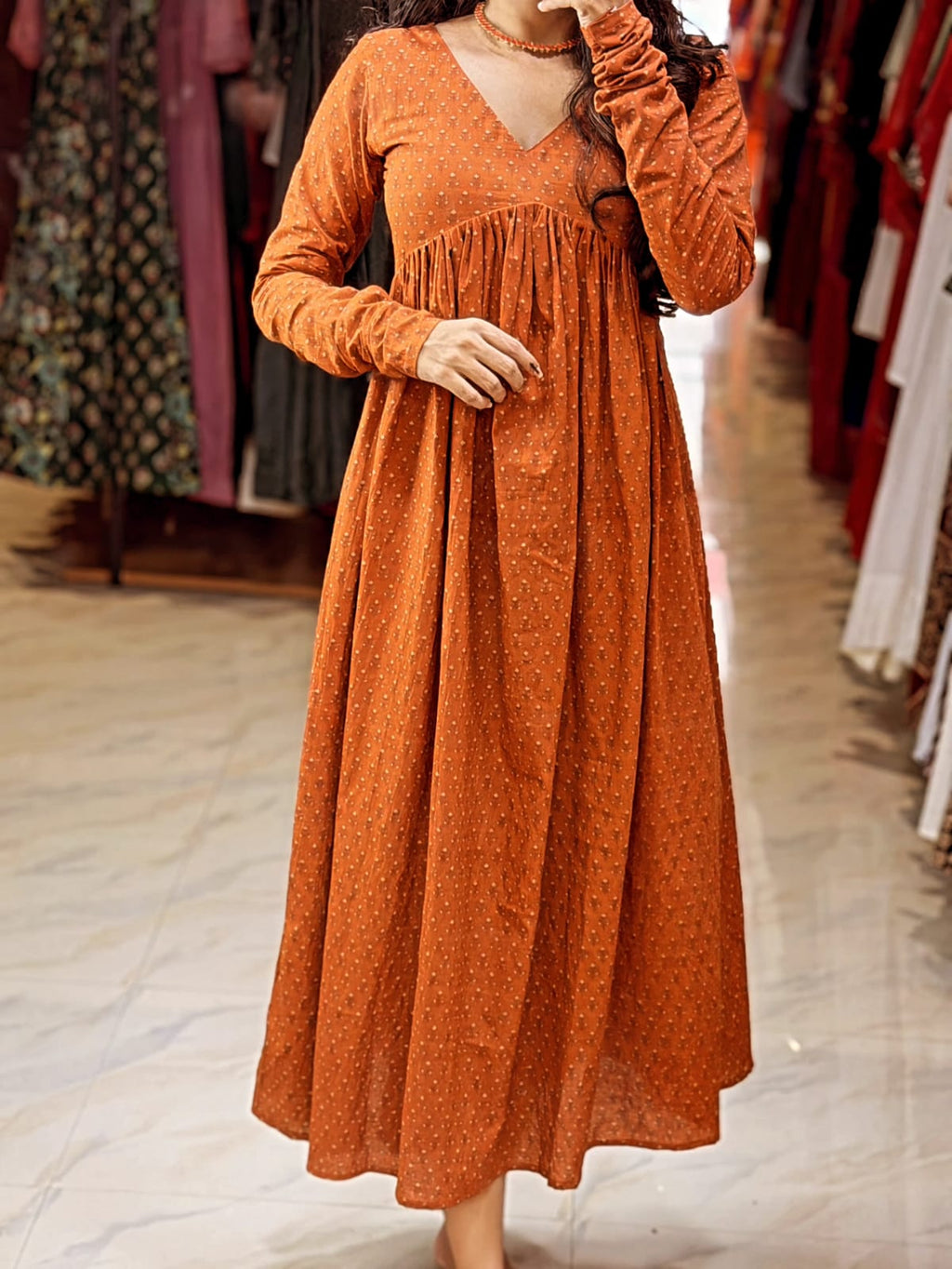 Detail of [PBC1032] – showing skirt flare and tiny floral booti block print on rust cotton