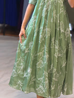 [PBC1038] Sage Green Floral Outline Mul Chanderi – close-up of skirt showing white floral outline print and fabric texture