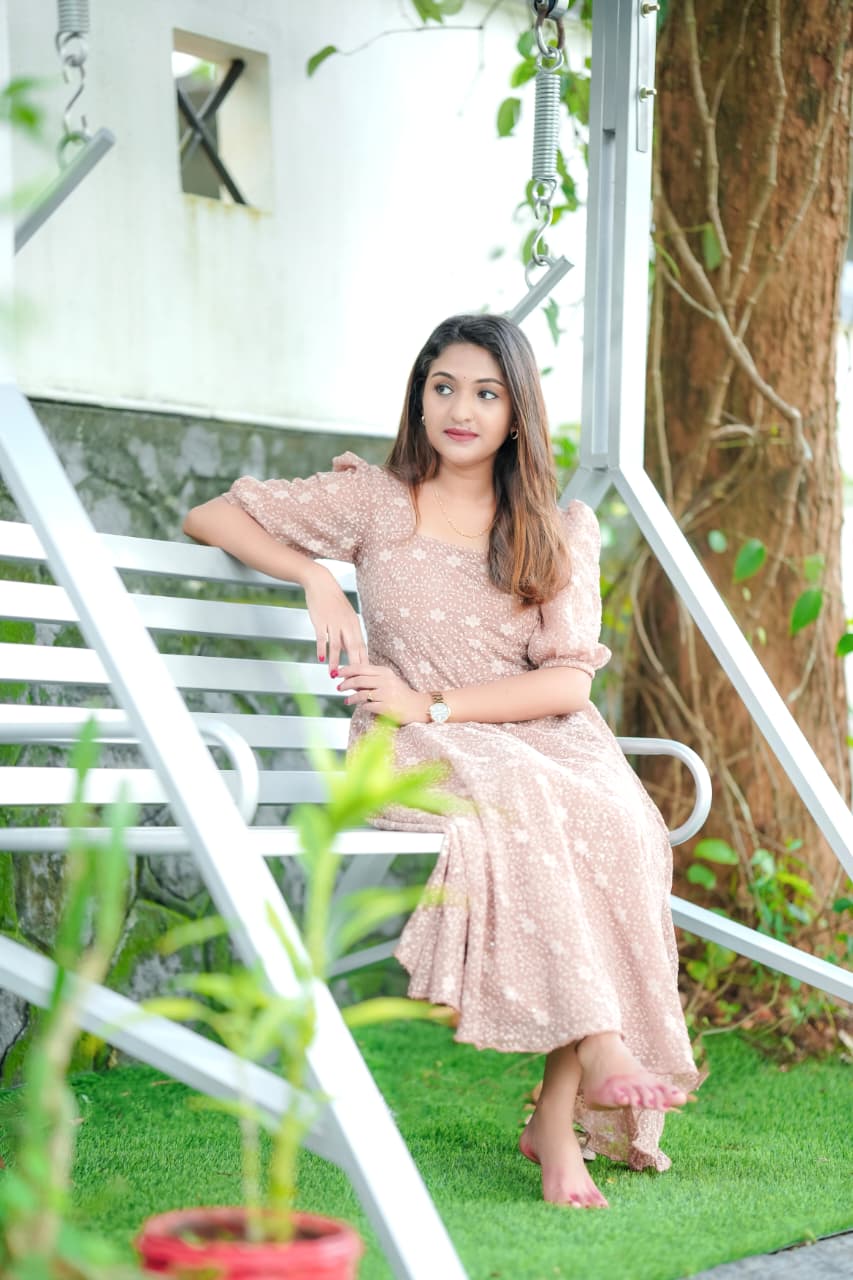 [PBC1044] Dusty Rose Floral Embroidered Georgette – seated on a garden swing showing the dress drape
