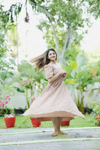 [PBC1044] Dusty Rose Floral Embroidered Georgette – twirling view showing the movement and flare of the skirt