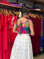 [PBC1076] Rainbow madras-check blouse with ivory kasavu skirt – full-length front view in a garden setting