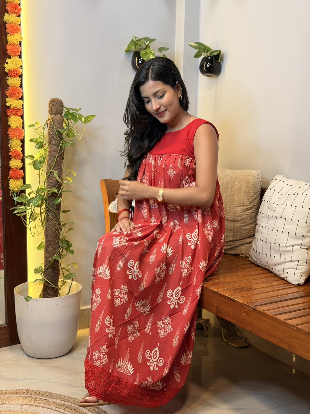 [PBC1082] Red lotus block-print Jaipur Soft Cotton – seated view showing the fabric drape and flare